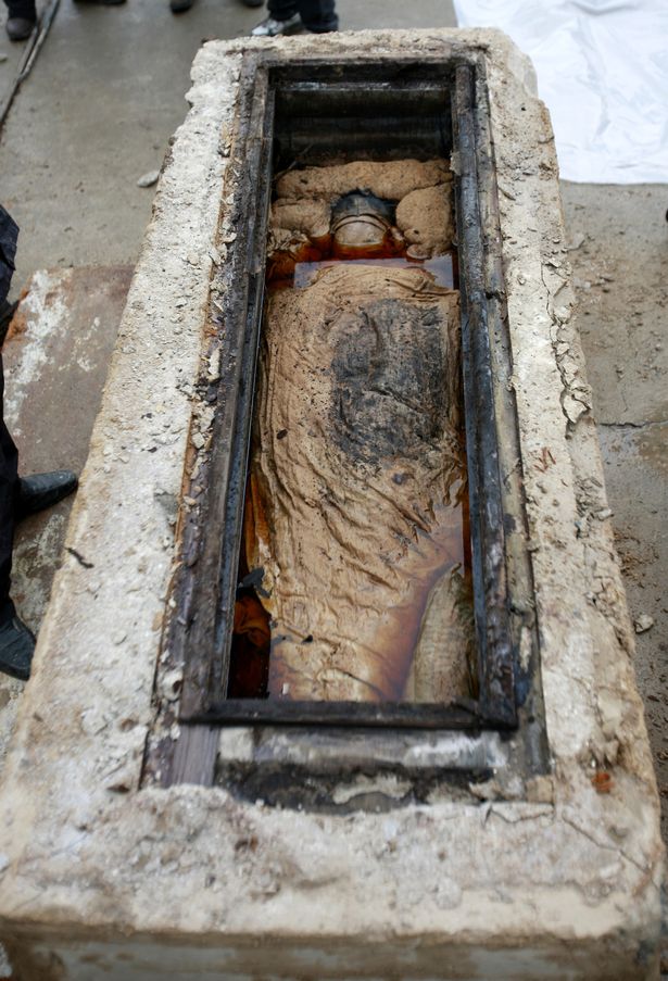 A perfectly preserved 700-year-old mummy in brown liquid looked only a few months old