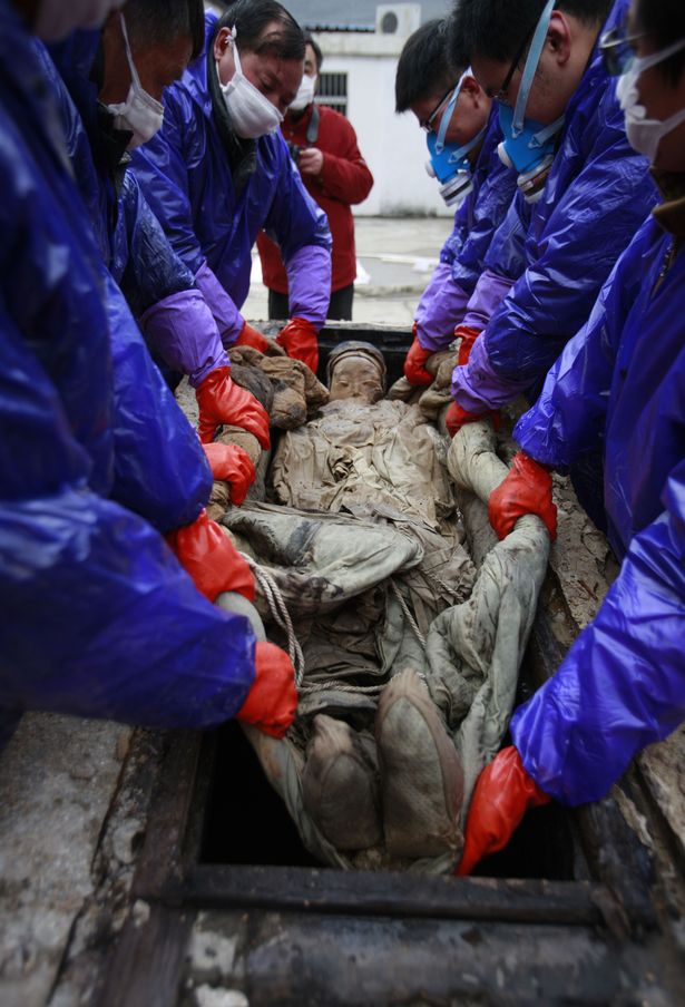 A perfectly preserved 700-year-old mummy in brown liquid looked only a few months old