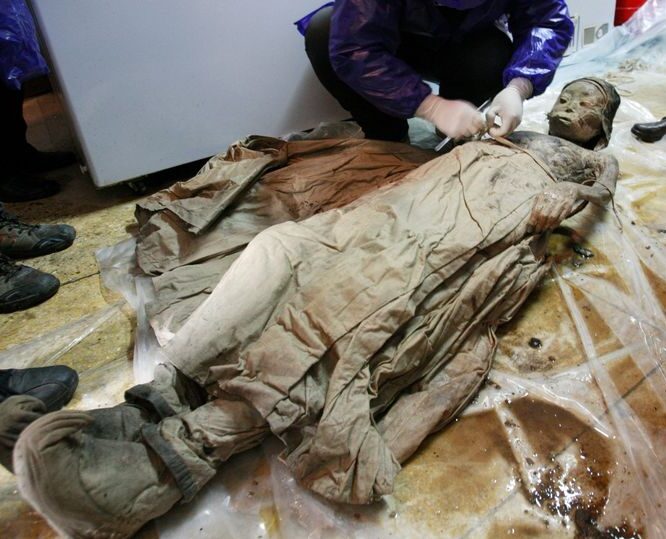 A perfectly preserved 700-year-old mummy in brown liquid